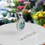 Load image into Gallery viewer, Ethereal Glow: Cyan Moissanite Centerpiece Pendant Necklace, Encircled by a Moissanites Halo
