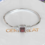 Load image into Gallery viewer, Crimson Elegance: 4.0ct Emerald Cut Garnet Bangle Bracelet Adorned with Marquise Moissanites
