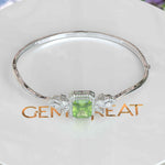 Load image into Gallery viewer, Green Serenity, 4.0ct Emerald Cut Peridot Bangle Bracelet Radiating Calm Elegance
