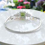 Load image into Gallery viewer, Green Serenity, 4.0ct Emerald Cut Peridot Bangle Bracelet Radiating Calm Elegance
