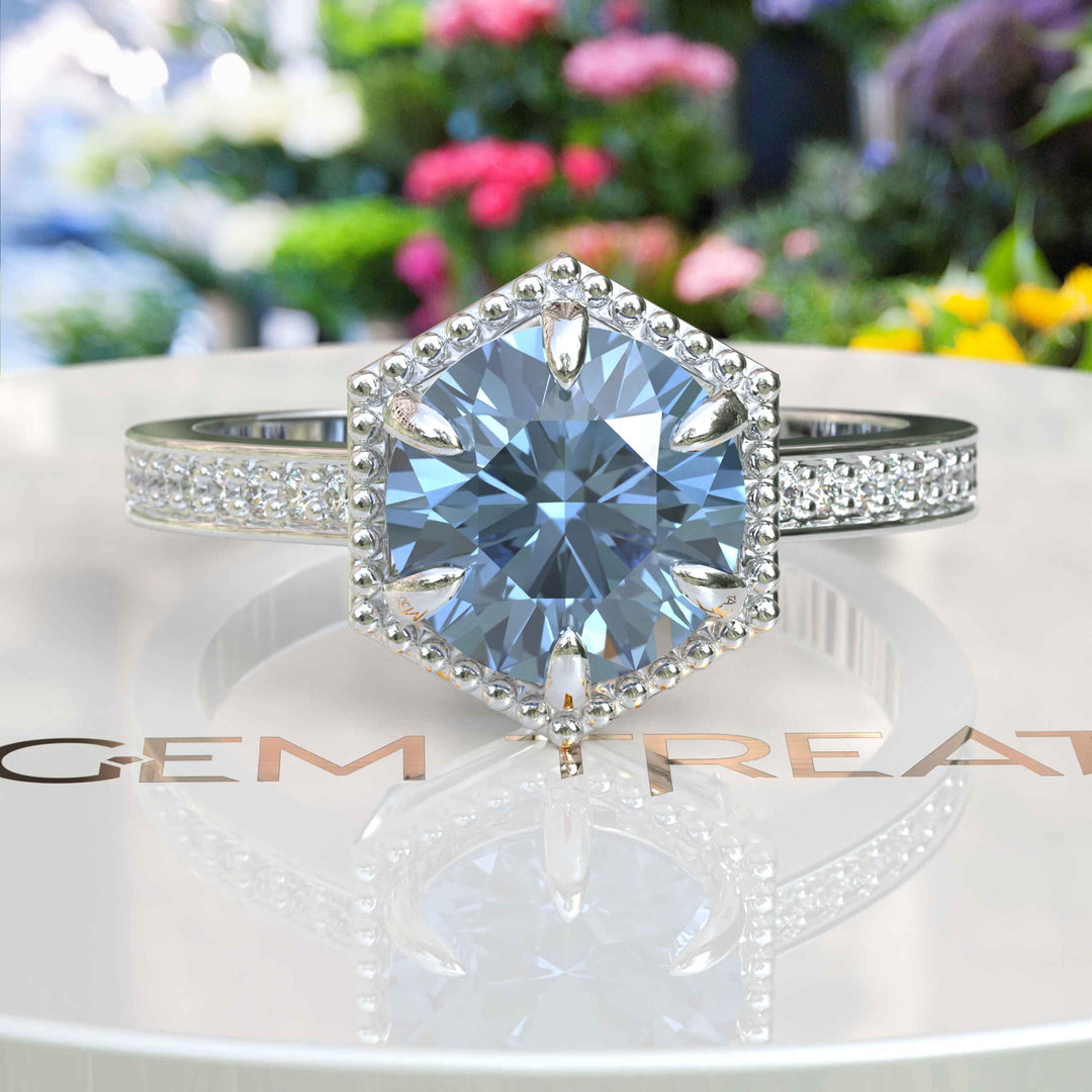 Elegance Defined: Round Blue Moissanite Centerpiece in Stunning Engagement Ring