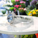 Load image into Gallery viewer, Elegance Defined: Round Blue Moissanite Centerpiece in Stunning Engagement Ring
