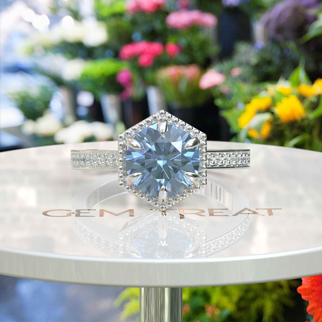 Elegance Defined: Round Blue Moissanite Centerpiece in Stunning Engagement Ring