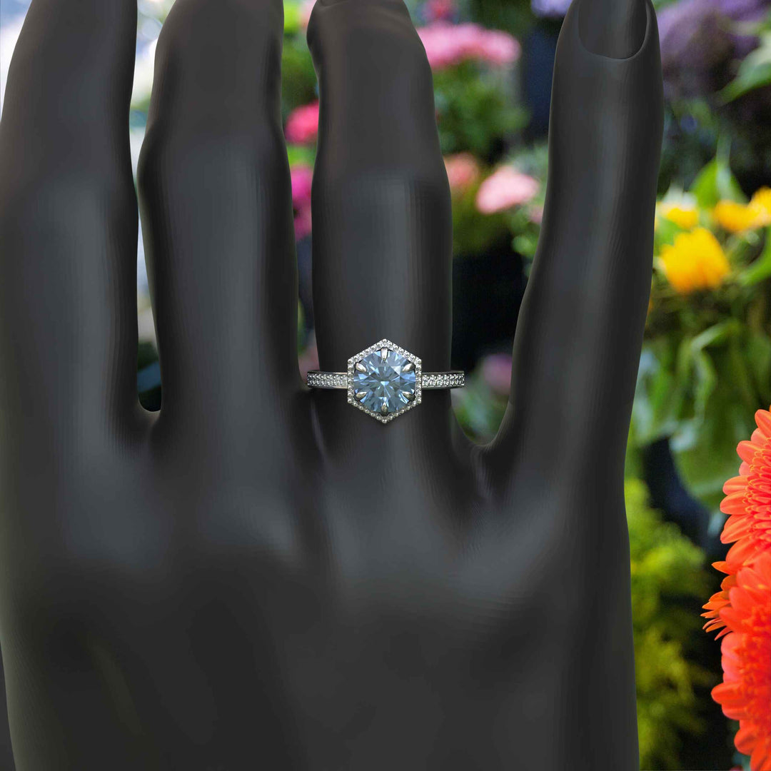 Elegance Defined: Round Blue Moissanite Centerpiece in Stunning Engagement Ring