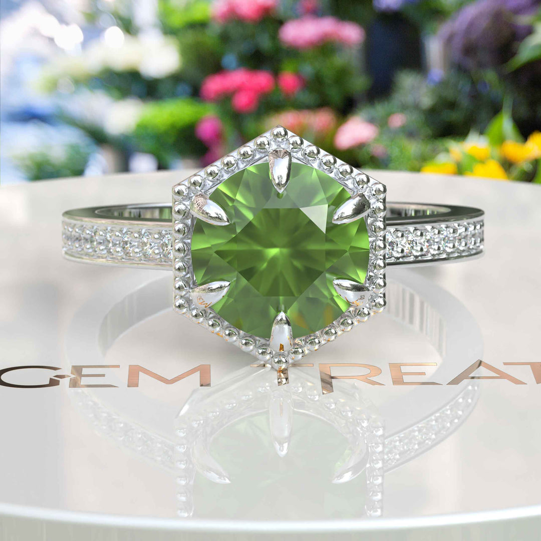 August's Elegance: Circular Peridot Ring Set in Miligrain-Edged Halo