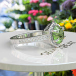 Load image into Gallery viewer, August&#39;s Elegance: Circular Peridot Ring Set in Miligrain-Edged Halo
