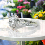 Load image into Gallery viewer, Elegant Round Colorless Moissanite Ring, Spotlighted by a Delicate Miligrain Halo
