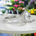 Load image into Gallery viewer, Elegant Round Colorless Moissanite Ring, Spotlighted by a Delicate Miligrain Halo
