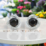 Load image into Gallery viewer, Night&#39;s Radiance: Round Black Onyx Stud Earrings with Moissanite Halo.
