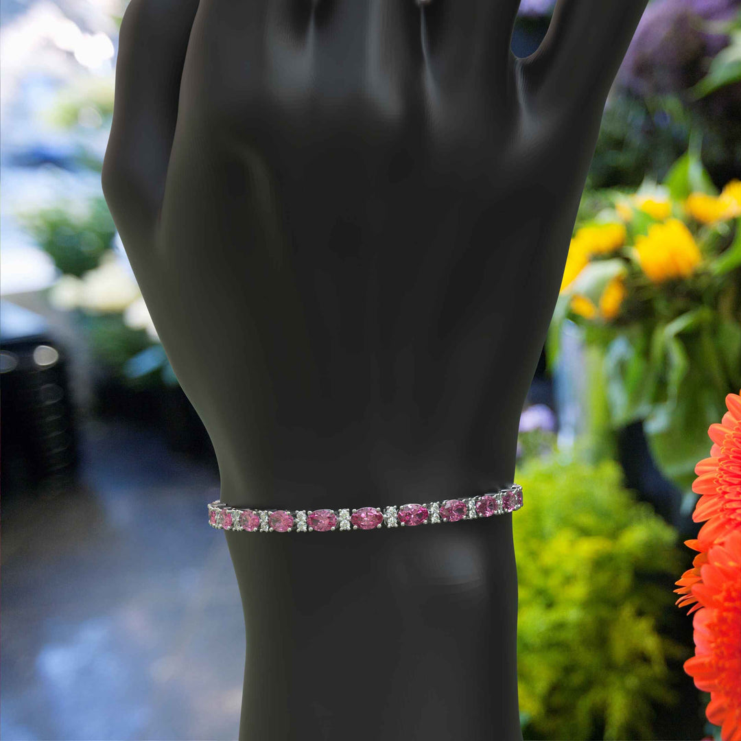 Glistening Array: Oval Pink Sapphire Tennis Bracelet with Alternating Moissanites