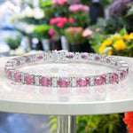 Load image into Gallery viewer, Glistening Array: Oval Pink Sapphire Tennis Bracelet with Alternating Moissanites
