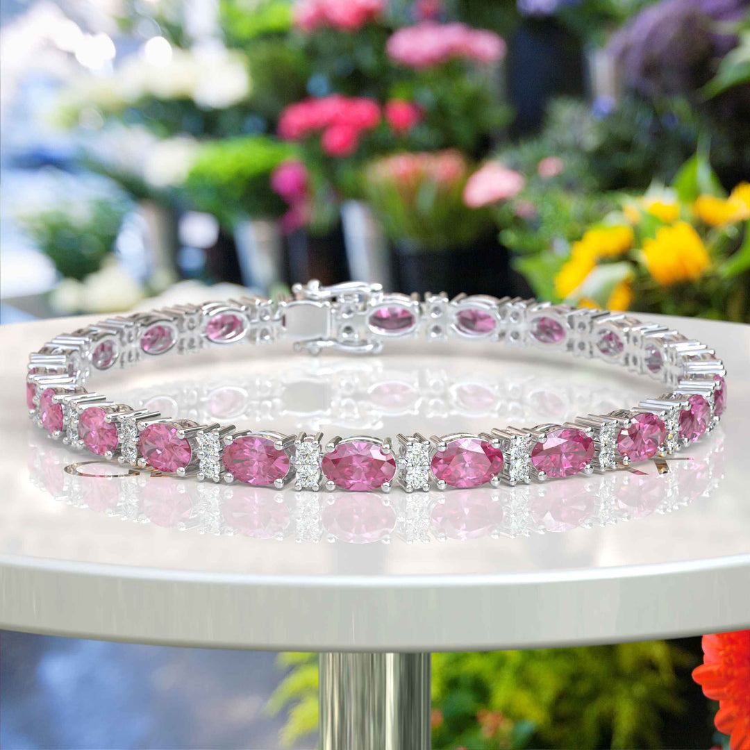 Glistening Array: Oval Pink Sapphire Tennis Bracelet with Alternating Moissanites