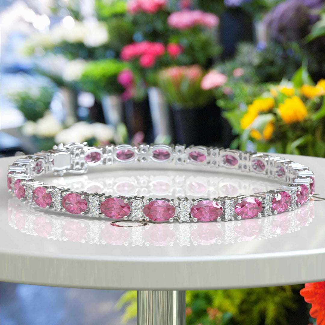 Glistening Array: Oval Pink Sapphire Tennis Bracelet with Alternating Moissanites