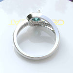 Load image into Gallery viewer, Breathtaking Cyan Blue Moissanite Halo Engagement Ring: A Symbol of Love
