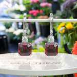 Load image into Gallery viewer, Red Rapture: Glistening Asscher Cut Ruby Drop Earrings.
