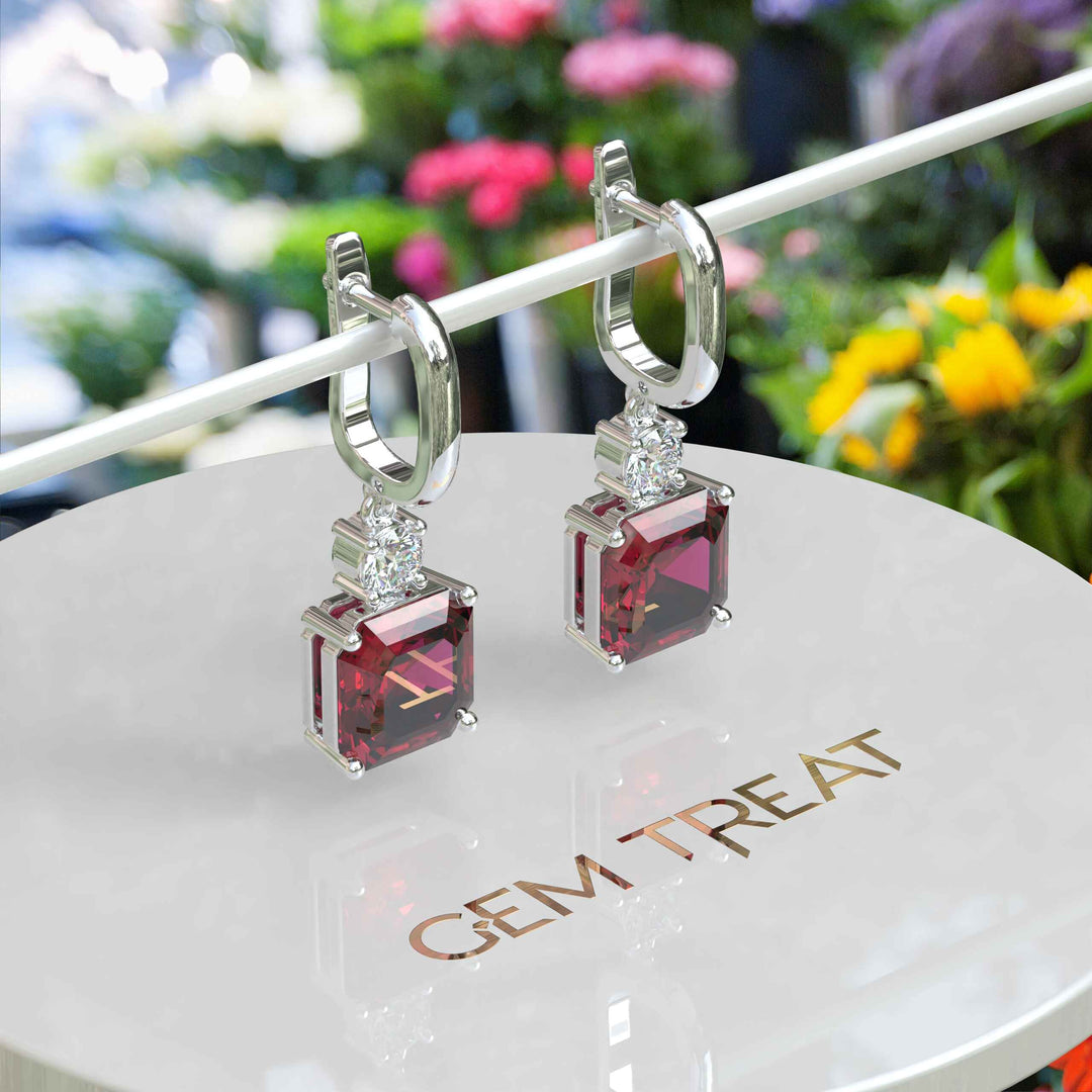 Red Rapture: Glistening Asscher Cut Ruby Drop Earrings.