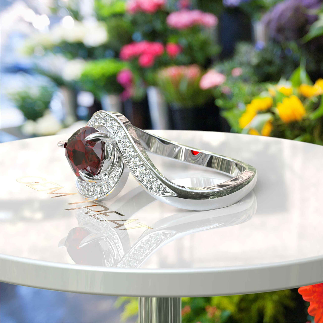 A Symphony in Red: Pear Cut Garnet Silver Halo Ring