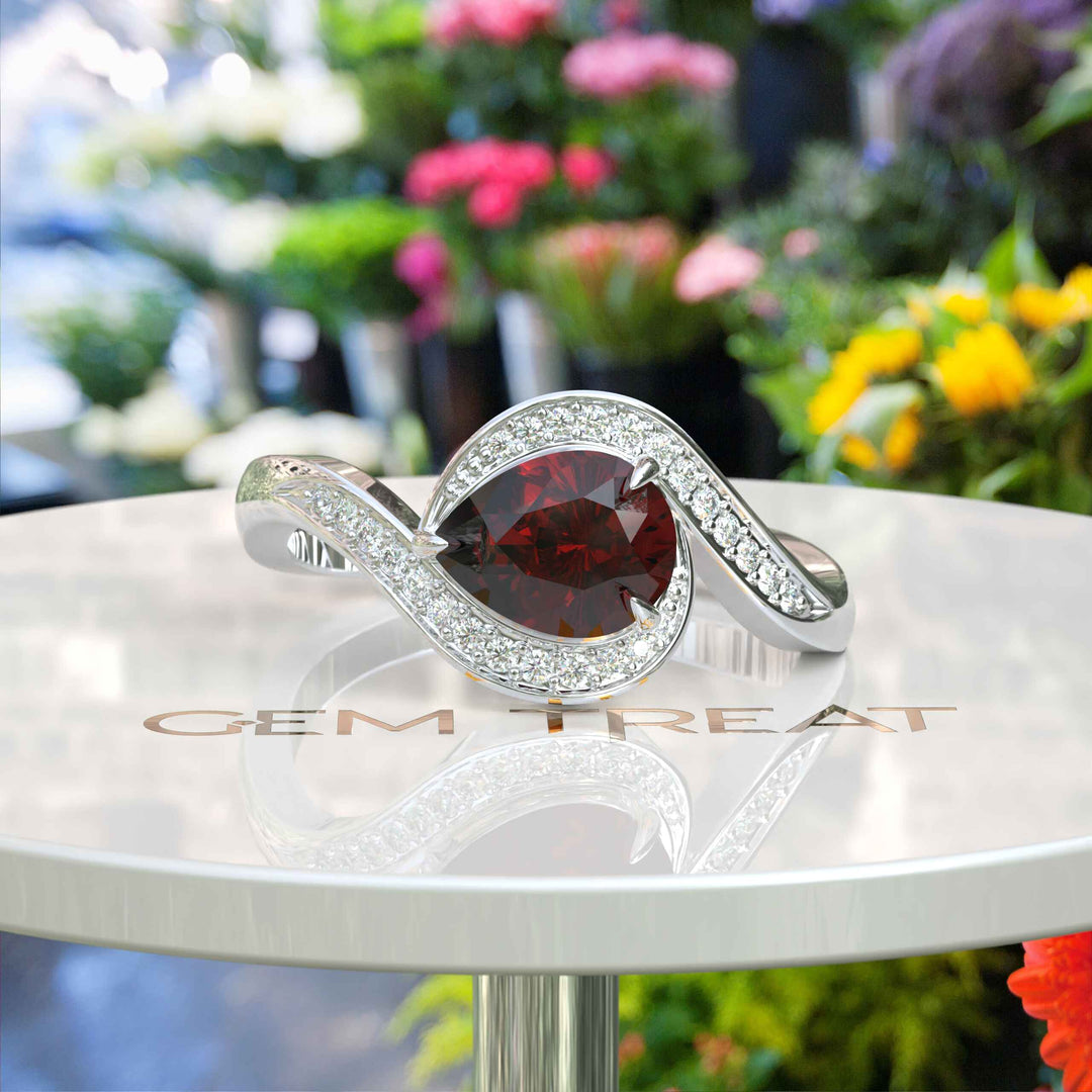 A Symphony in Red: Pear Cut Garnet Silver Halo Ring