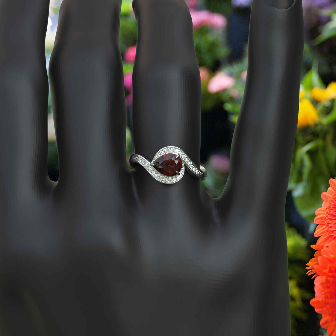 A Symphony in Red: Pear Cut Garnet Silver Halo Ring