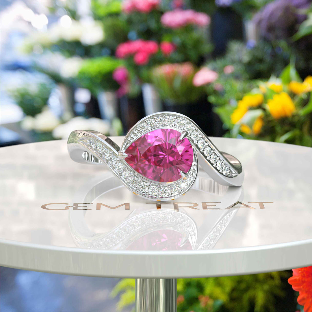 Elegance Redefined: Dive into the Halo Pear Cut Pink Sapphire Ring's Charm