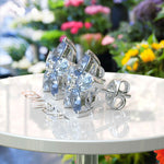 Load image into Gallery viewer, Floral Fantasy: Clustered Pear Cut Blue Moissanite Earrings.
