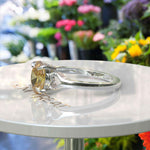 Load image into Gallery viewer, Golden Sunlight Captured: Oval Cut Yellow Sapphire in Solitaire Ring Setting
