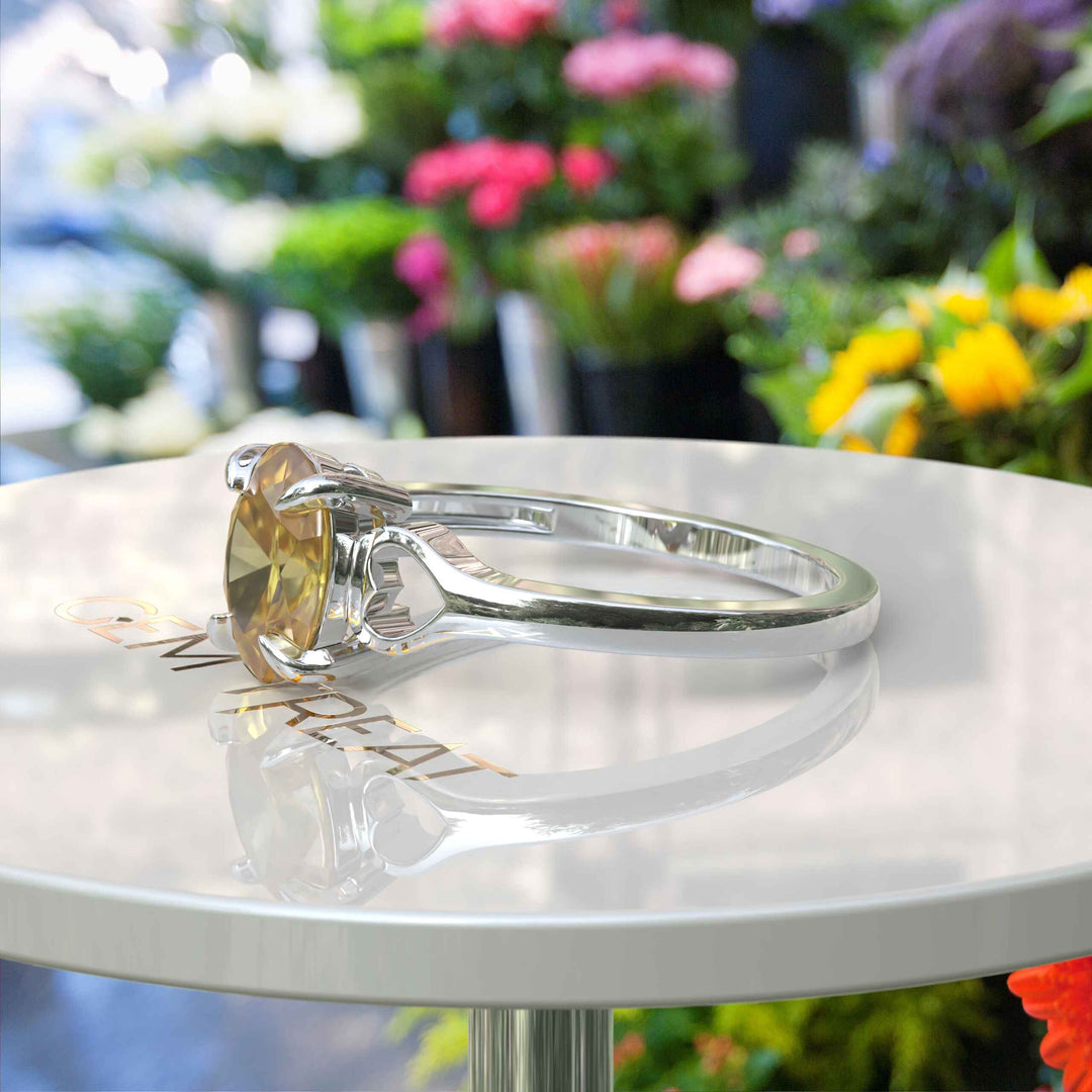 Golden Sunlight Captured: Oval Cut Yellow Sapphire in Solitaire Ring Setting