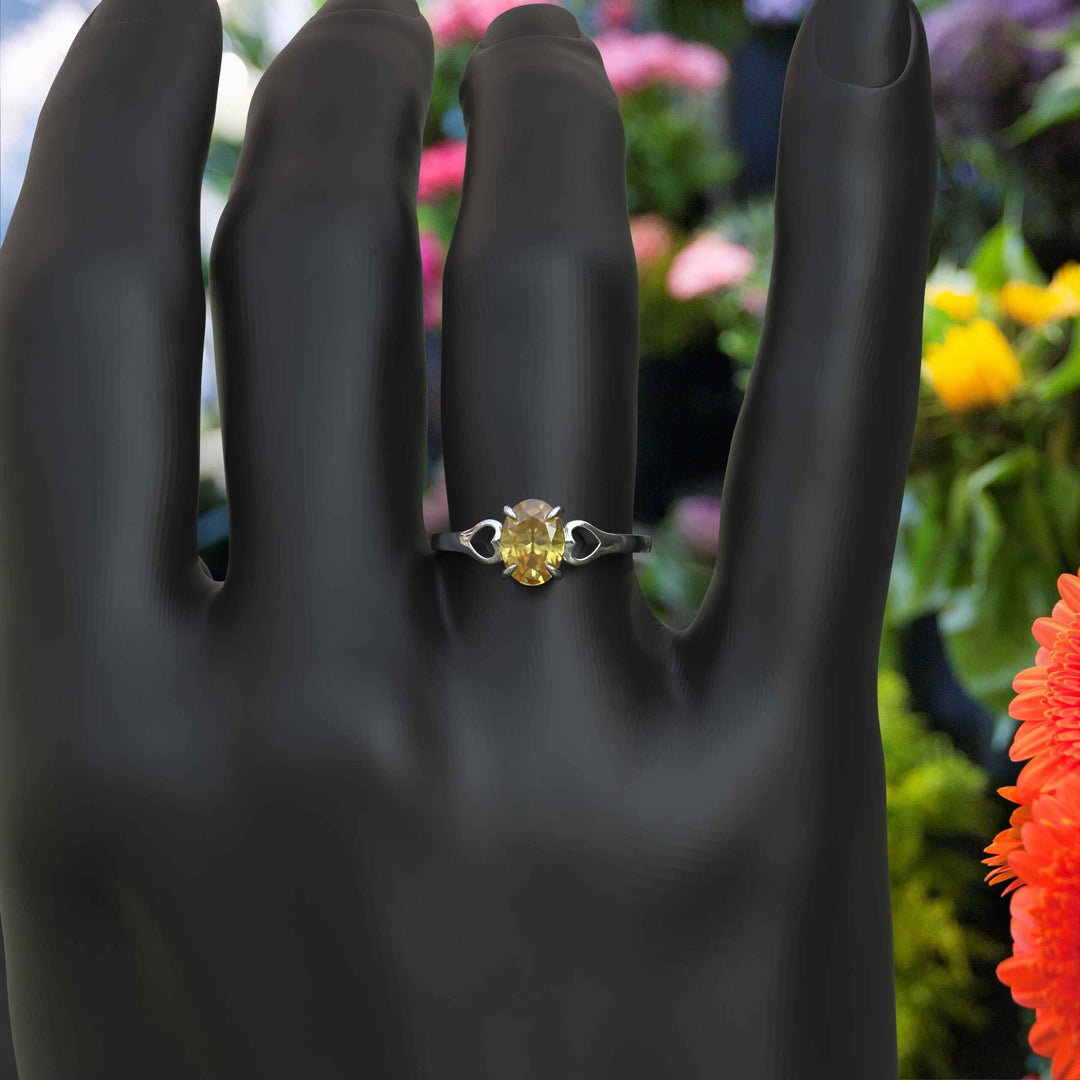 Golden Sunlight Captured: Oval Cut Yellow Sapphire in Solitaire Ring Setting