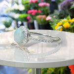 Load image into Gallery viewer, Cosmic Beauty: Round Opal Halo Ring in Silver Setting
