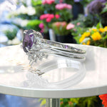 Load image into Gallery viewer, Nuptial Hues in Purple: Oval Amethyst Wedding Ring Set, Adorned by Marquise Side Gems
