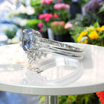 Load image into Gallery viewer, Elegance Redefined: Oval Blue Moissanite Ring Set &amp; Marquise Moissanite Highlights
