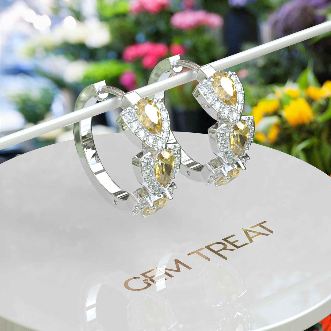 Sunlit Sparkle: Pear Cut Yellow Sapphire Hoop Earrings Encased in Moissanite Halo.