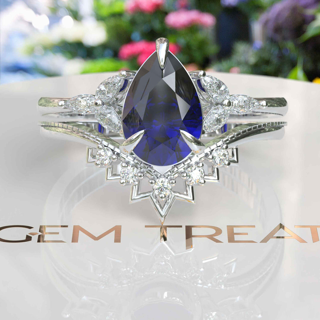 Timeless Love Story: Pear Blue Sapphire Wedding Set & Marquise Moissanite Details