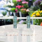 Load image into Gallery viewer, Mesmerizing Tides: Cyan Blue Moissanite Hoop Earrings with Baguette Cut.
