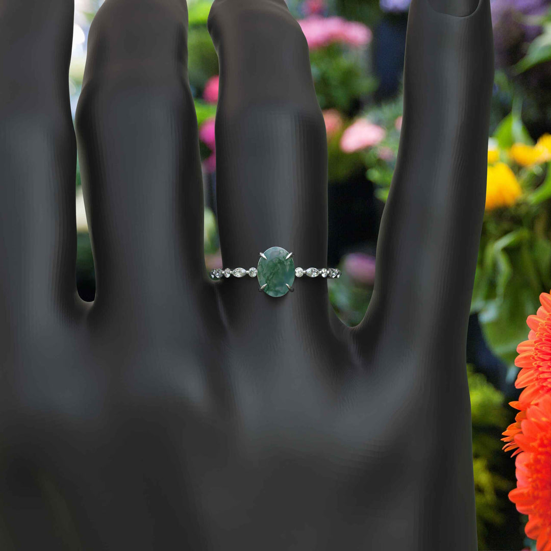 Nature's Artistry on Display: Adorned Oval Moss Agate Ring with Distinctive Patterns