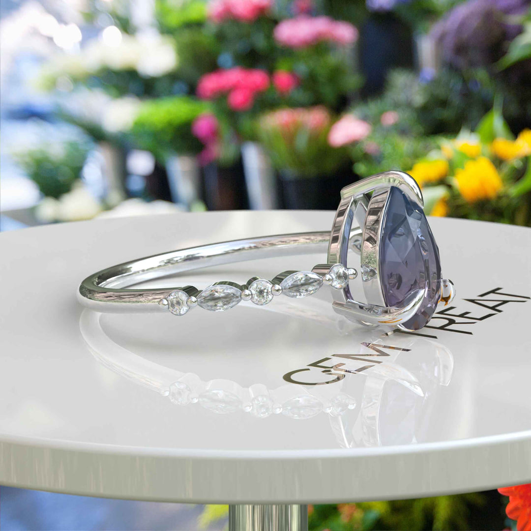 Gemstone Grace: Pear Alexandrite Ring Embellished with Marquise Moissanite Accents