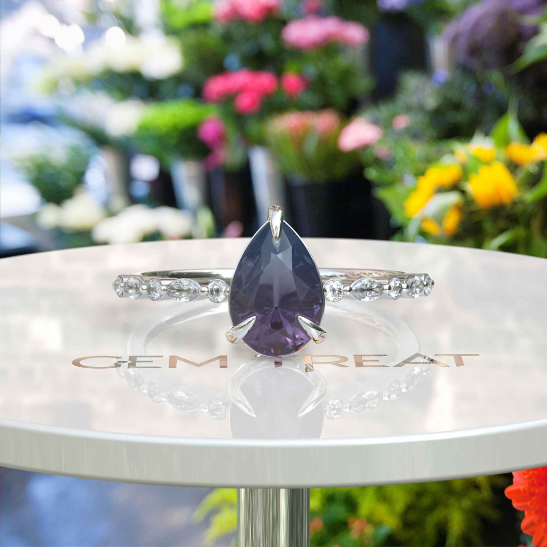 Gemstone Grace: Pear Alexandrite Ring Embellished with Marquise Moissanite Accents