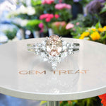 Load image into Gallery viewer, Blush Tones Meet Brilliance: Oval Morganite Ring Set, Enhanced by Marquise Moissanites
