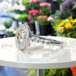 Load image into Gallery viewer, Golden Glimmer: Round Champagne Moissanite Crowned with Halo Brilliance.
