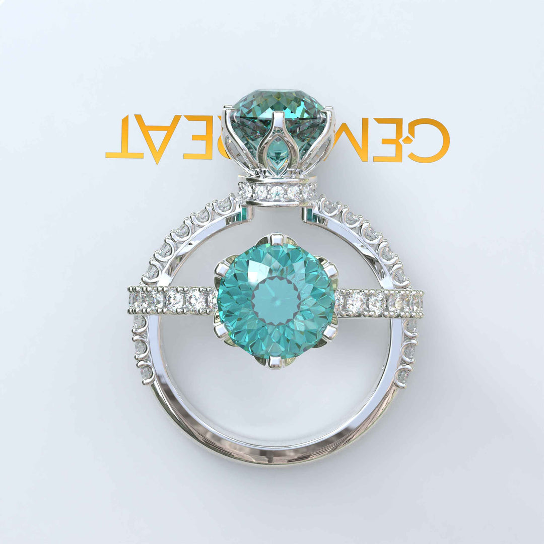 Ocean's Serenade Captured: Cyan Blue Portuguese Cut Adorns Under Halo Ring Setting