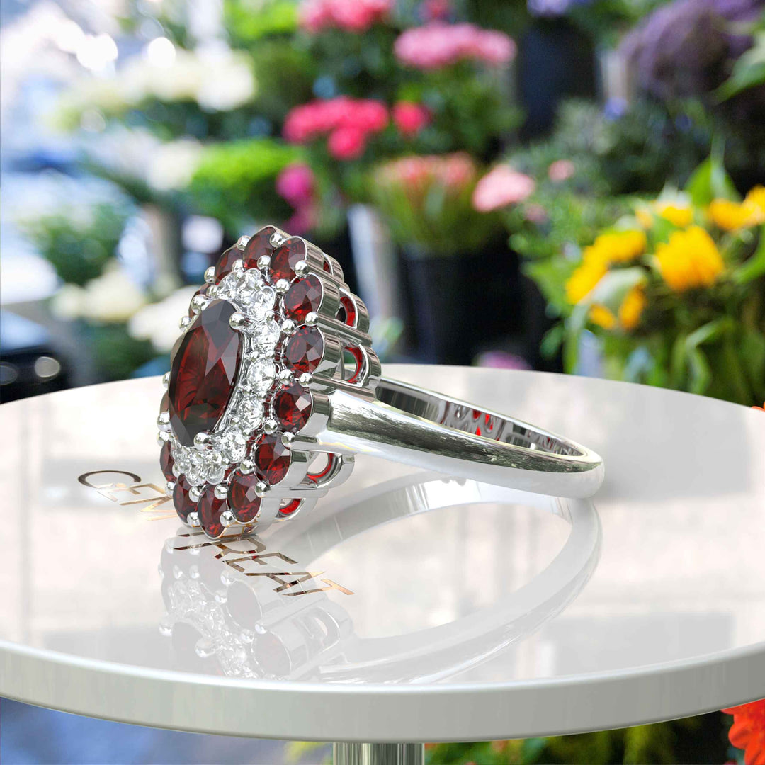 Whispers of Romance: Discover the Lustrous Oval Halo Garnet within This Ring Design