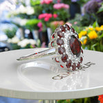 Load image into Gallery viewer, Whispers of Romance: Discover the Lustrous Oval Halo Garnet within This Ring Design
