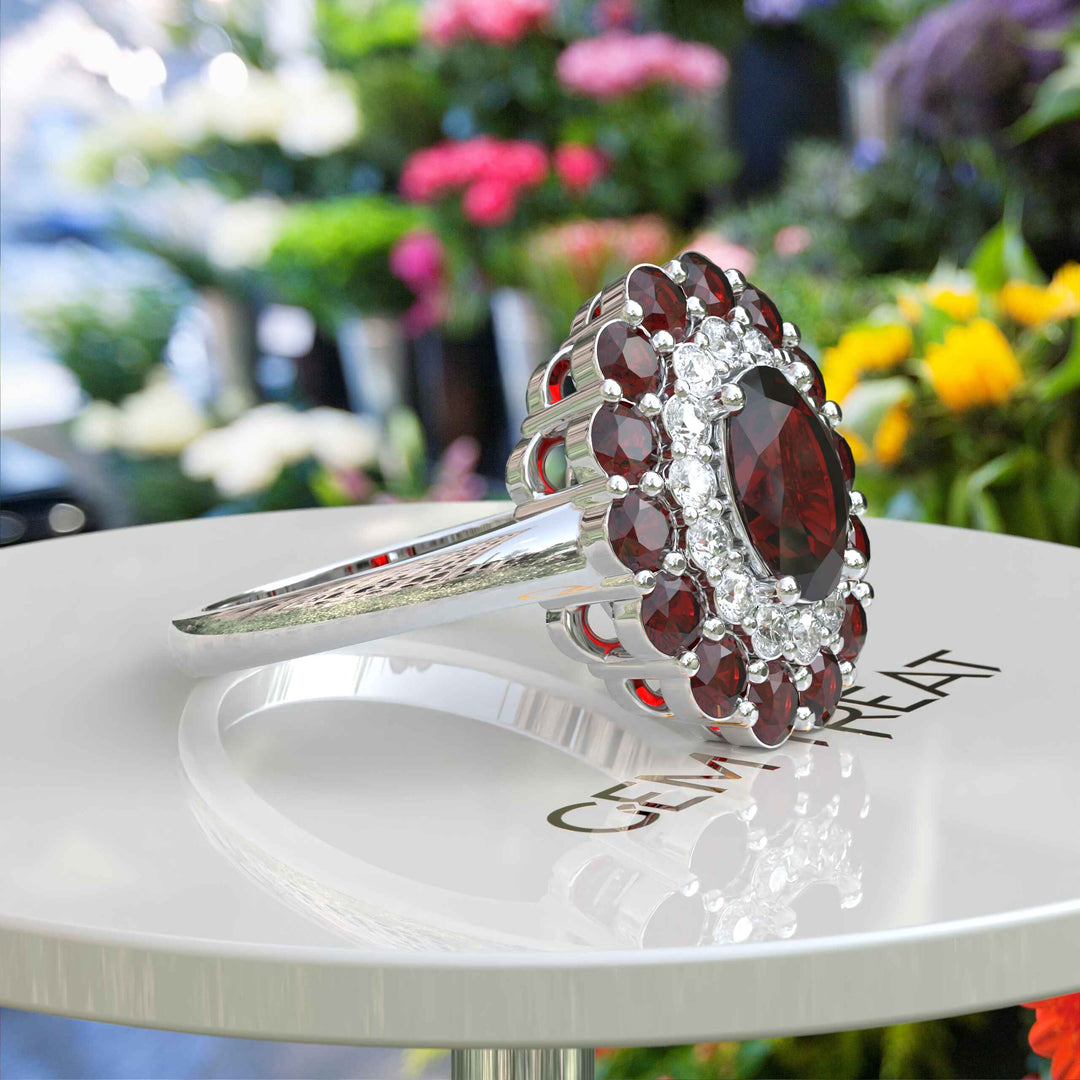 Whispers of Romance: Discover the Lustrous Oval Halo Garnet within This Ring Design