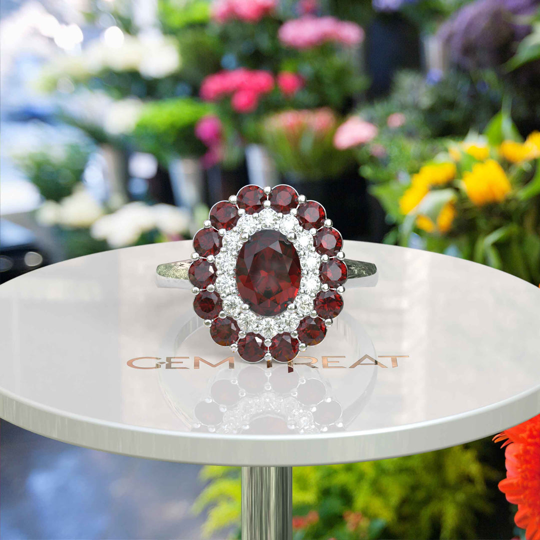 Whispers of Romance: Discover the Lustrous Oval Halo Garnet within This Ring Design