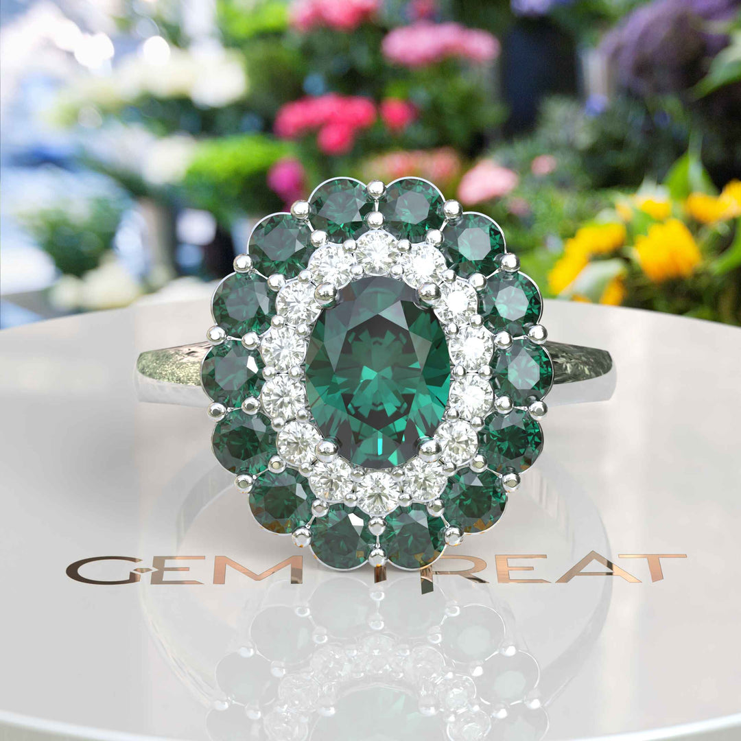 Emerald Oasis: Double Halo Oval Green Emerald Ring with Moissanite & Emerald Embellishments.