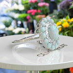 Load image into Gallery viewer, Ethereal Glow: Oval Opal Centerpiece Ring Surrounded by Moissanite and Opal Halo
