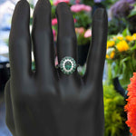 Load image into Gallery viewer, Emerald Oasis: Double Halo Oval Green Emerald Ring with Moissanite &amp; Emerald Embellishments.
