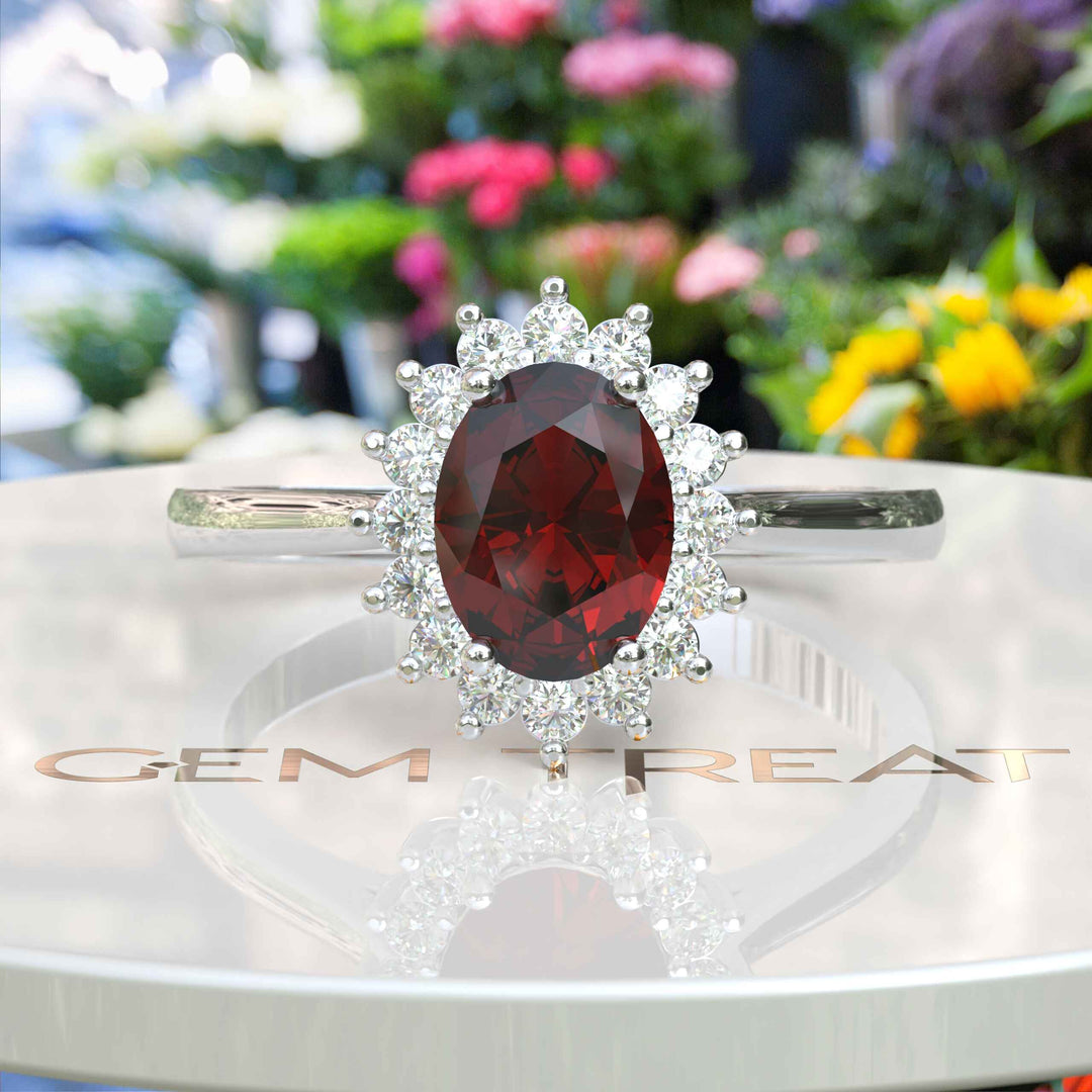 Moissanite Halo Surrounds a Brilliant Oval Red Garnet Ring