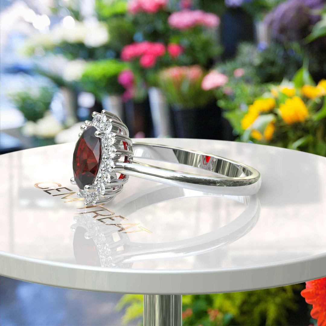 Moissanite Halo Surrounds a Brilliant Oval Red Garnet Ring