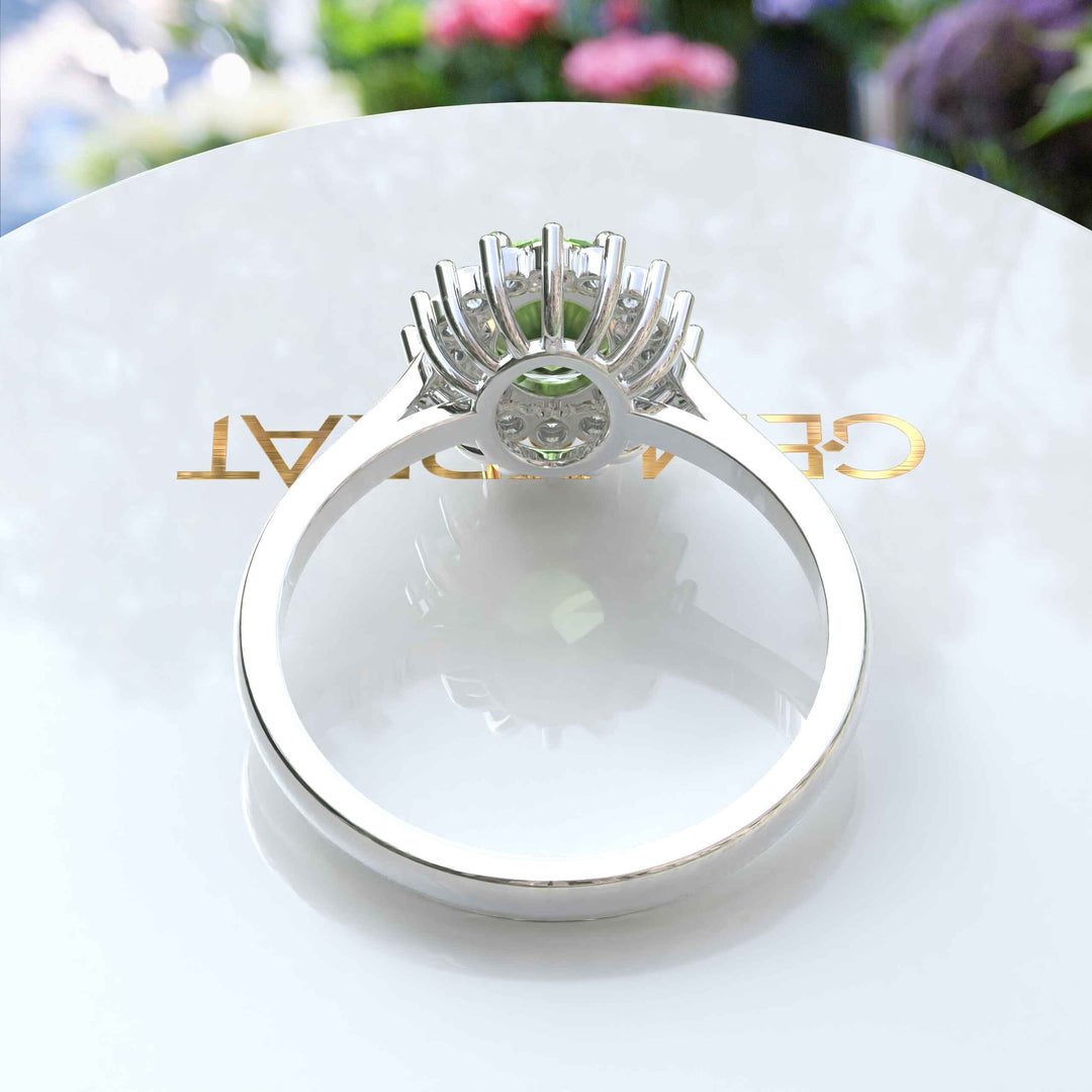 Vibrant Elegance Unleashed: Celebrate with an Oval Peridot Center in This Halo Ring